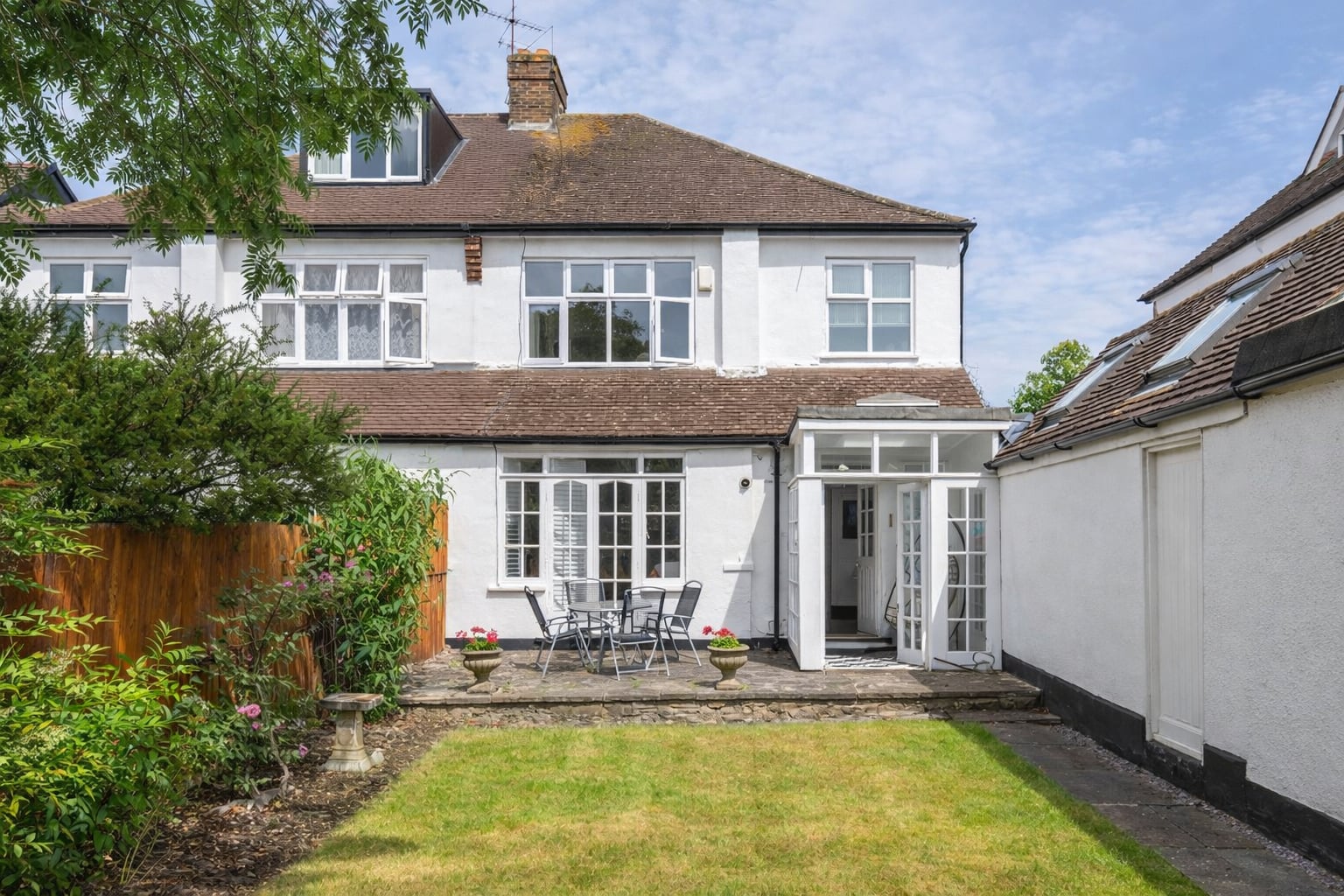 Rear elevation viewed from the garden at Cleveland Park, W13